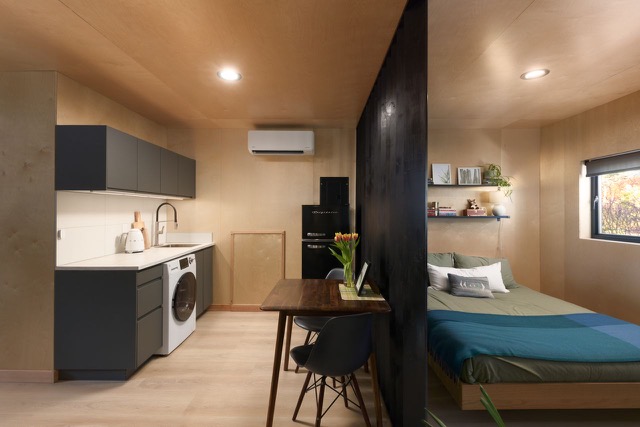 Garden cottage finished interior with kitchenette, dining nook and bedroom